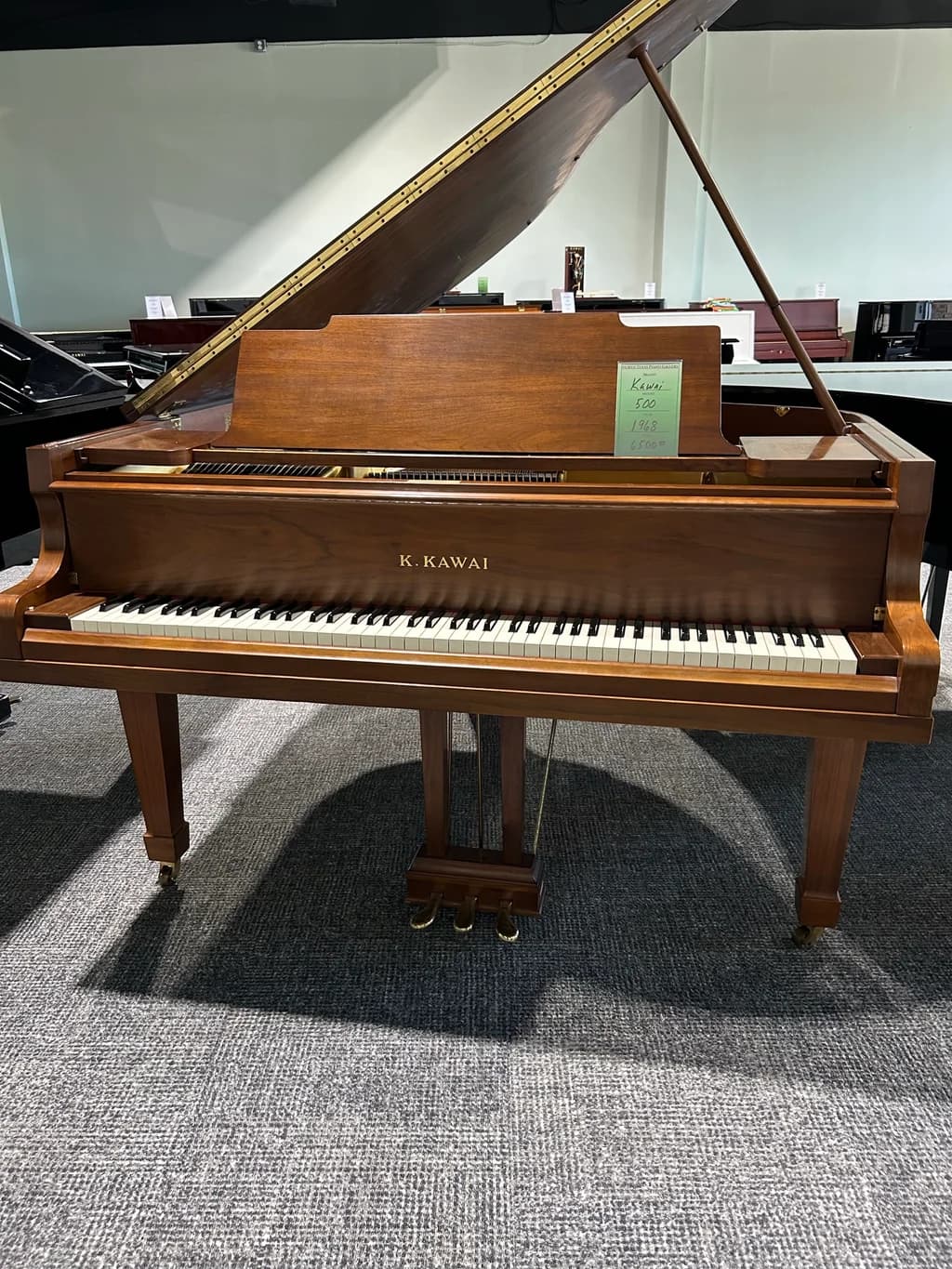 1968 Kawai 500 grand piano in satin walnut, full view with lid open