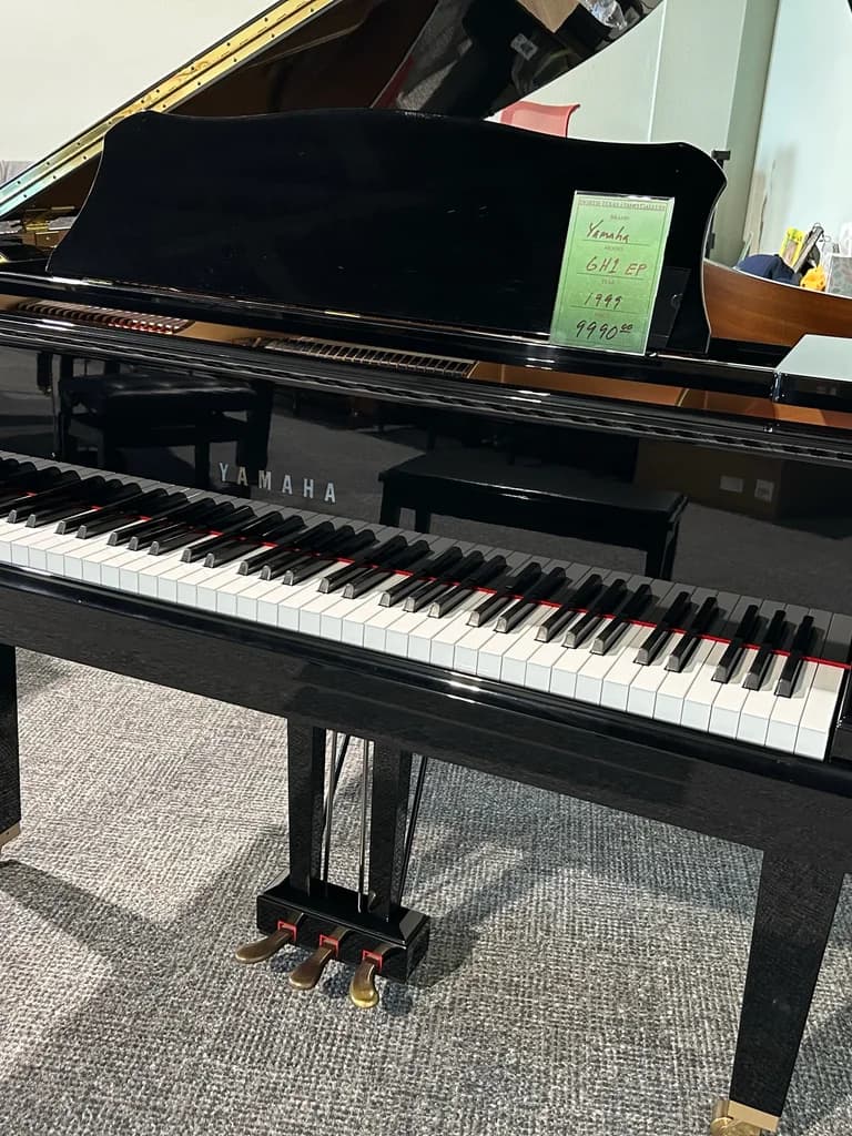 1999 Yamaha GH1 baby grand piano in polished ebony, three-quarter view