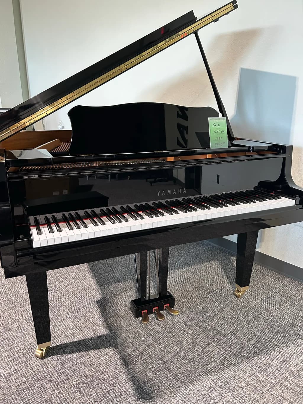 1999 Yamaha GH1 baby grand piano in polished ebony, front view with lid open
