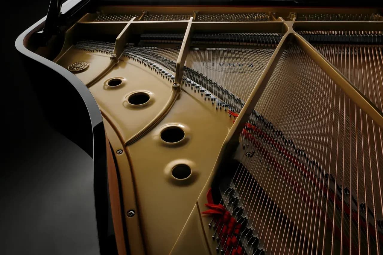 The V-Pro plate and strings inside a Kawai GL Series grand piano